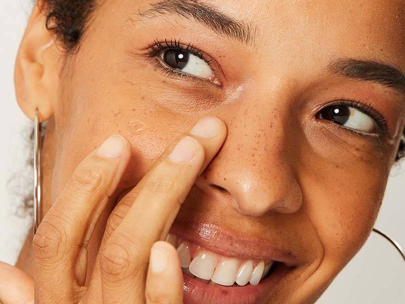 person applying makeup