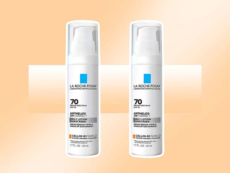 Two bottles of La Roche-Posay Anthelios UV Correct Face Sunscreen SPF 70 With Niacinamide on a graphic cream background